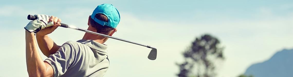 Golfer finishing shot in Virginia