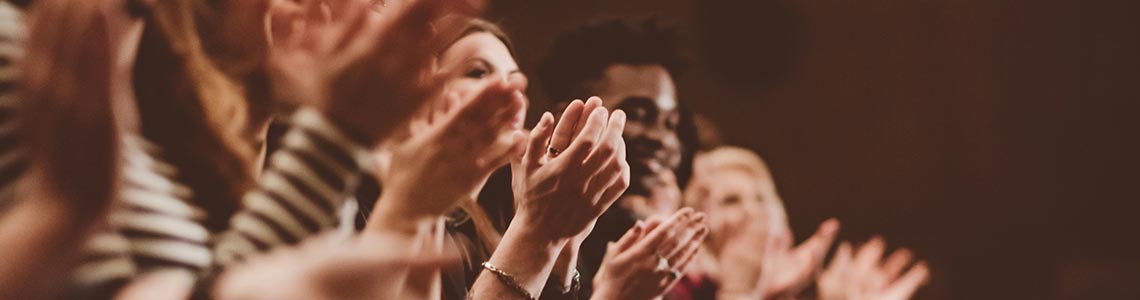 People clapping at a performance in Wolf Trap National Park