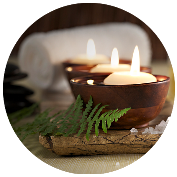 Spa arrangement with zen basalt stones, flower and candle
