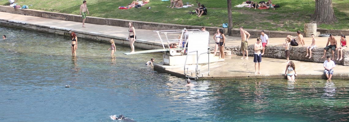 People swimming at a Texas swimming hole.