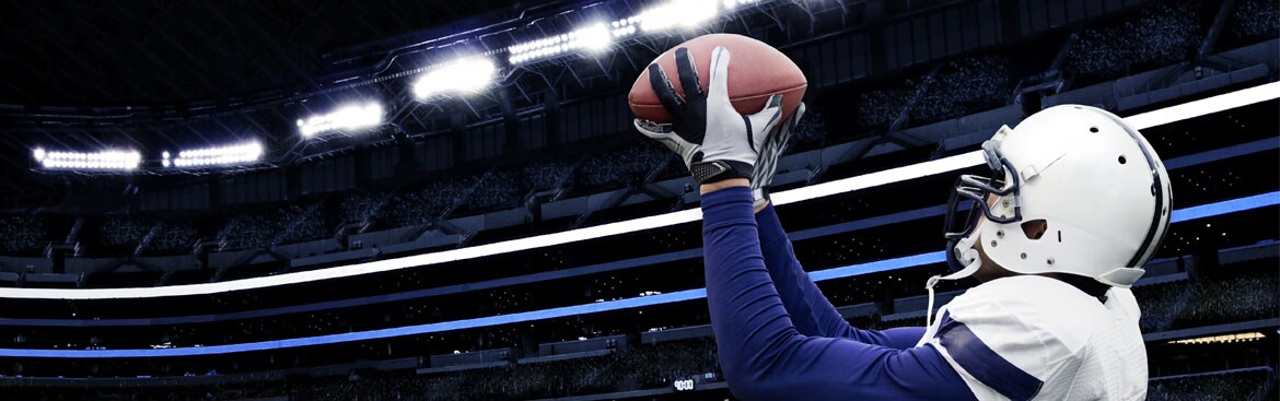 Football player catching football