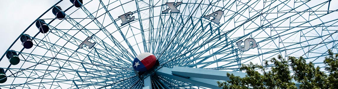Ferris wheel with Texas sign on it.
