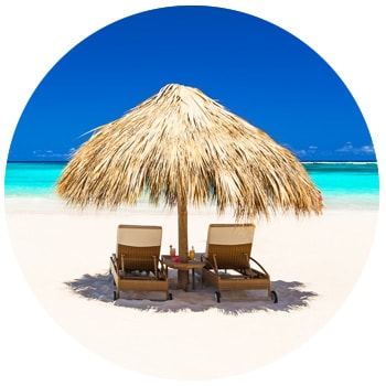 Thatch beach umbrella on pristine beach