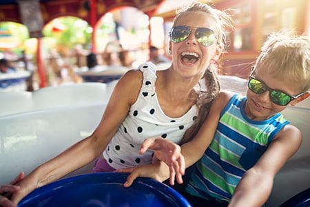 Kids laughing on a carousel ride