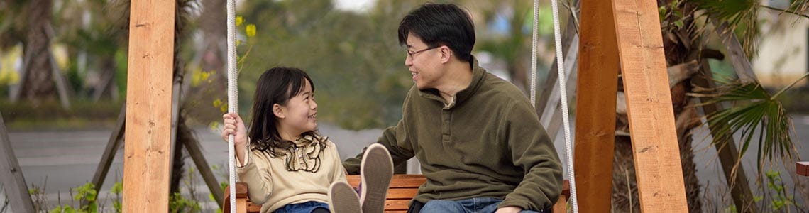 Father and Daughter on Swing