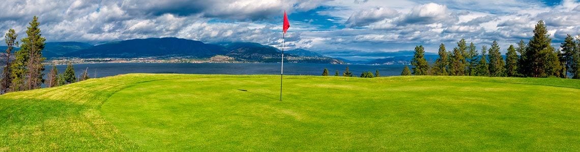 Golf course green overlooking a lake in BC