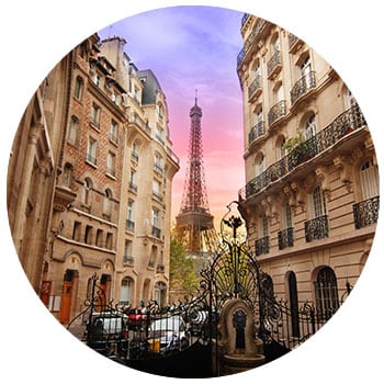 Eiffel Tower in France behind classic french styled buildings