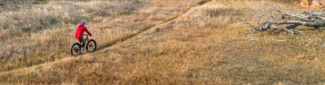Man mountain biking on a trail in Colorado