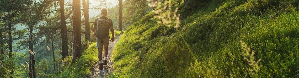 Senior man trail hiking in the forest In Idaho