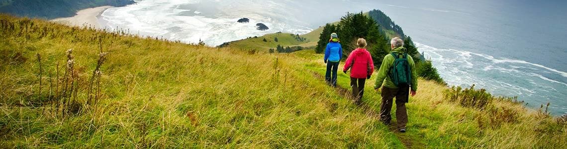 Hikers on a trail near the Oregon coast