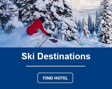 Image of person skiing down a snowy mountain