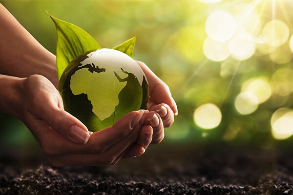 hands holding glass globe