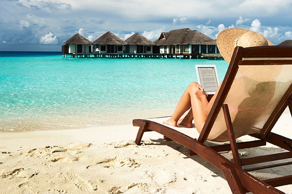 Redeem Best Western Rewards Points Woman On Beach Relaxing Chair Reading E Book
