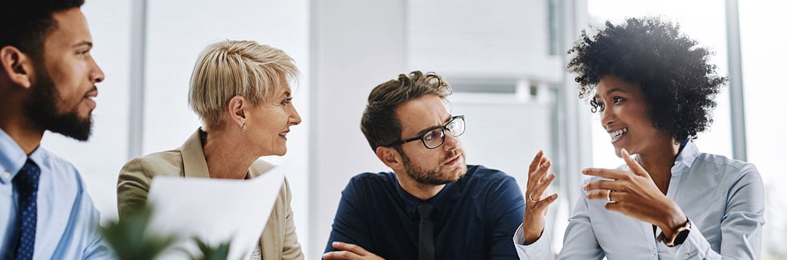 People at a table planning a meeting